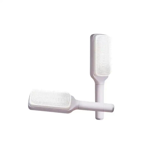 Brosse à cheveux autonettoyante